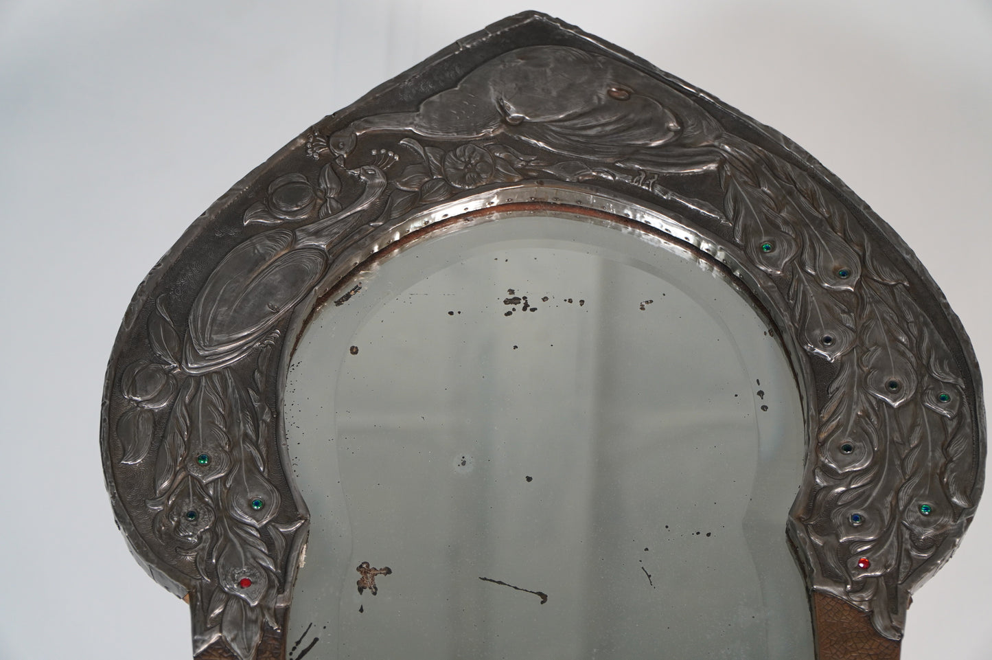 glasgow school Nouveau Mirror with Embossed Metal Frame and Peacock Feather Design